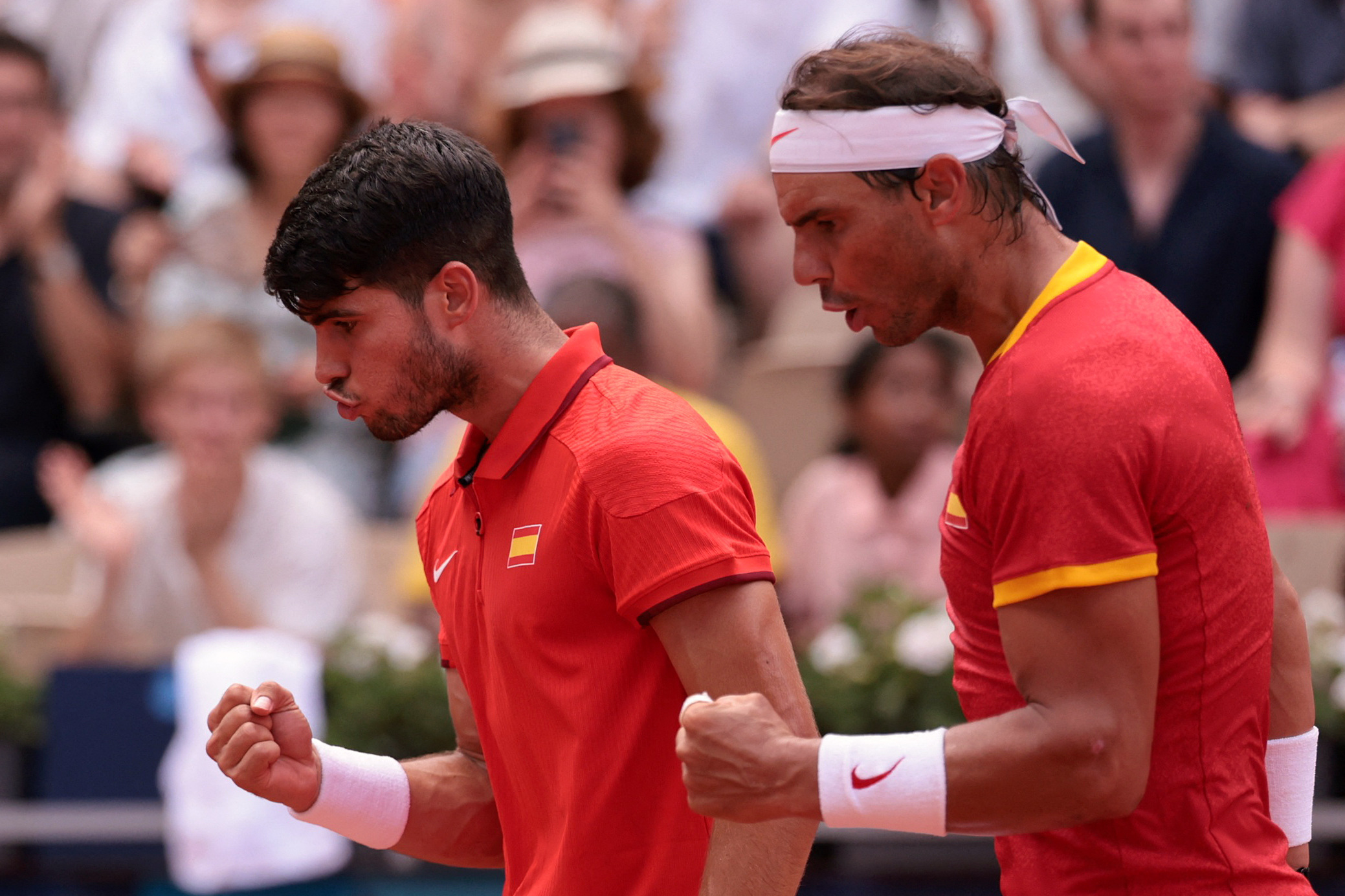 Paris 2024 Olympics - Tennis - Men's Doubles Second Round - Roland-Garros Stadium, Paris, France - July 30, 2024. Carlos Alcaraz of Spain and Rafael Nadal of Spain react during their match against Tallon Griekspoor of Netherlands and Wesley Koolhof of Netherlands. REUTERS/Claudia Greco