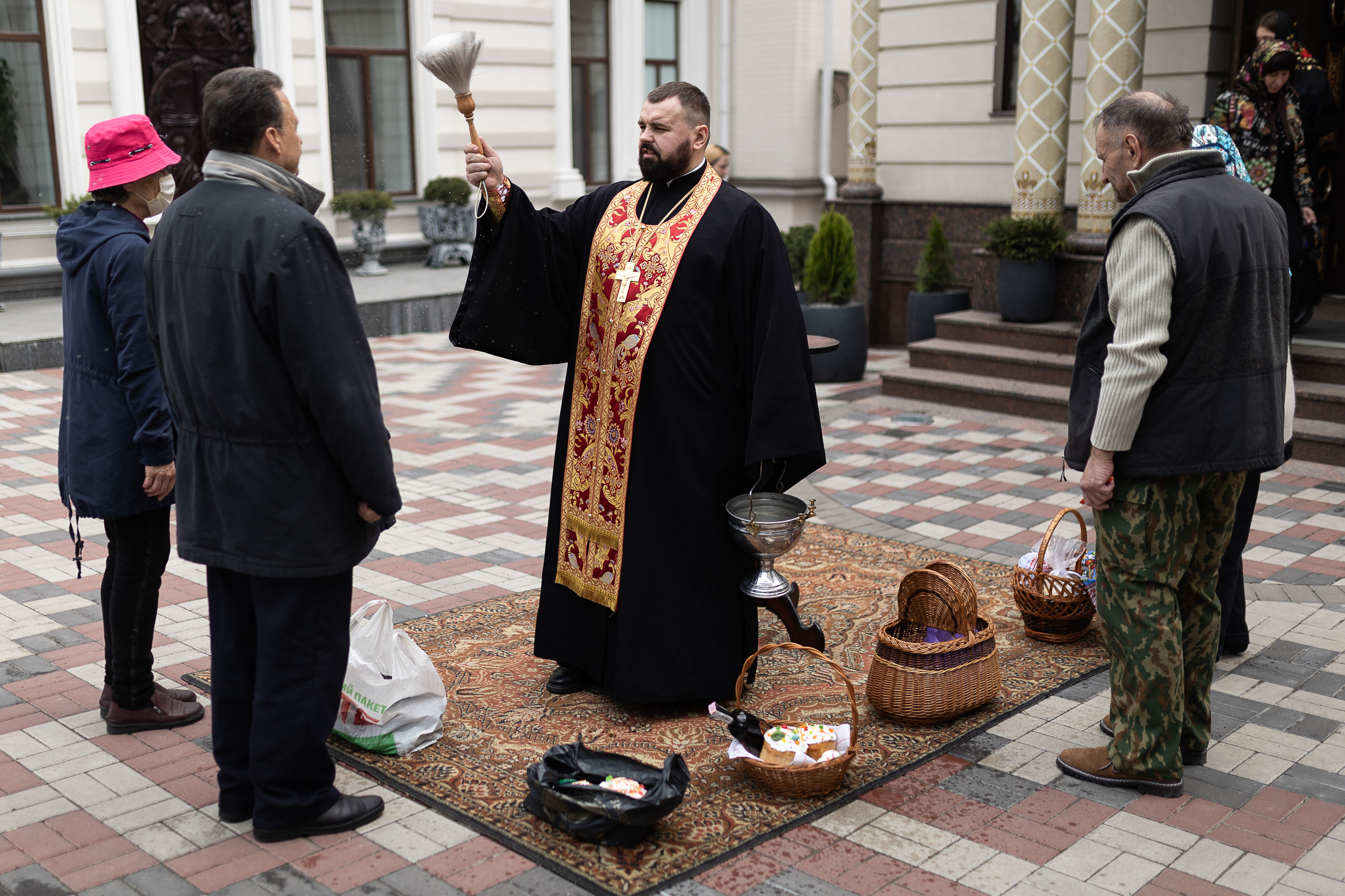 A priest blessing parishioners and their food in Dnipro on Sunday.