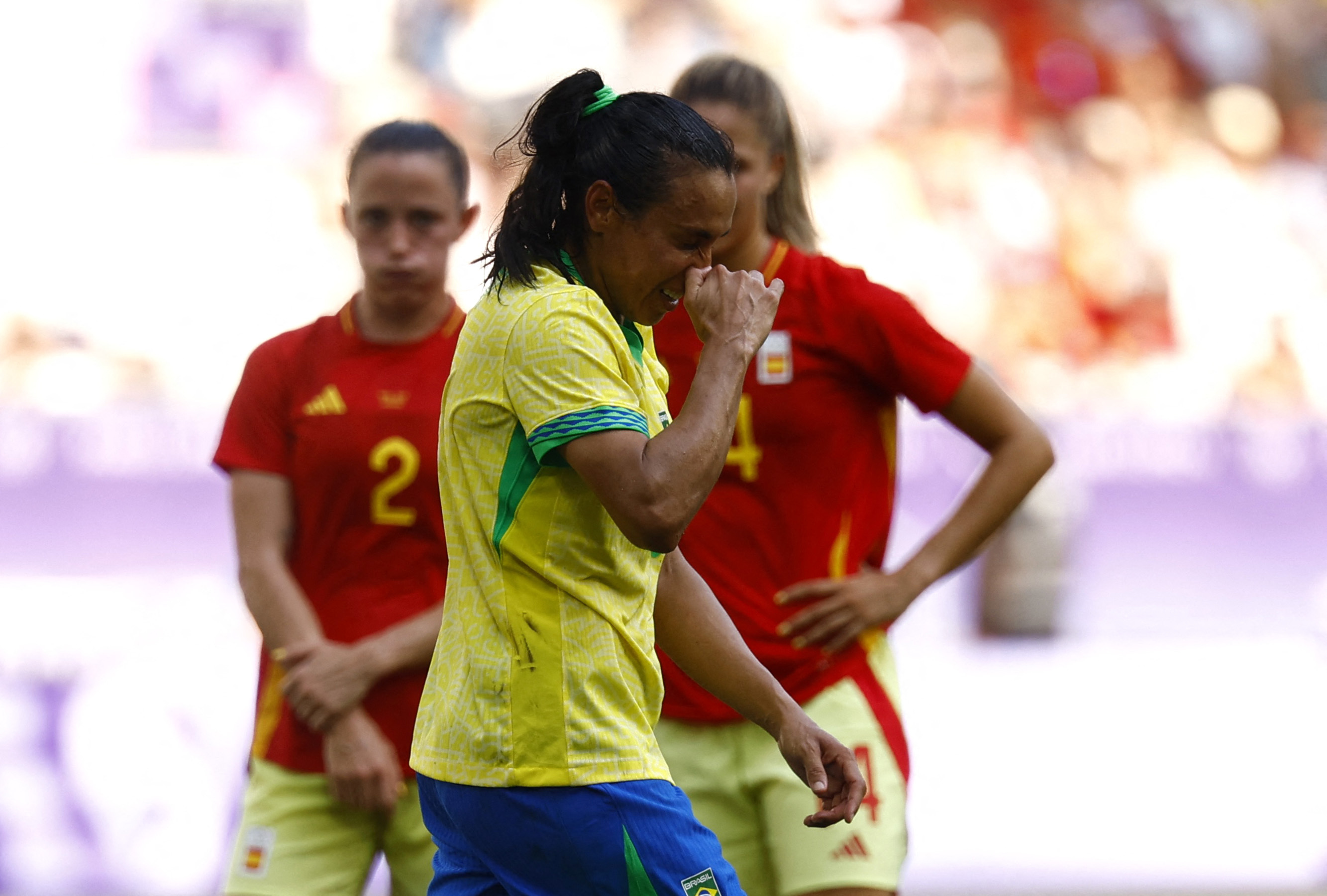 Paris 2024 Olympics - Football - Women's Group C - Brazil vs Spain - Bordeaux Stadium, Bordeaux, France - July 31, 2024. Marta of Brazil leaves the pitch after being shown a red card. REUTERS/Susana Vera