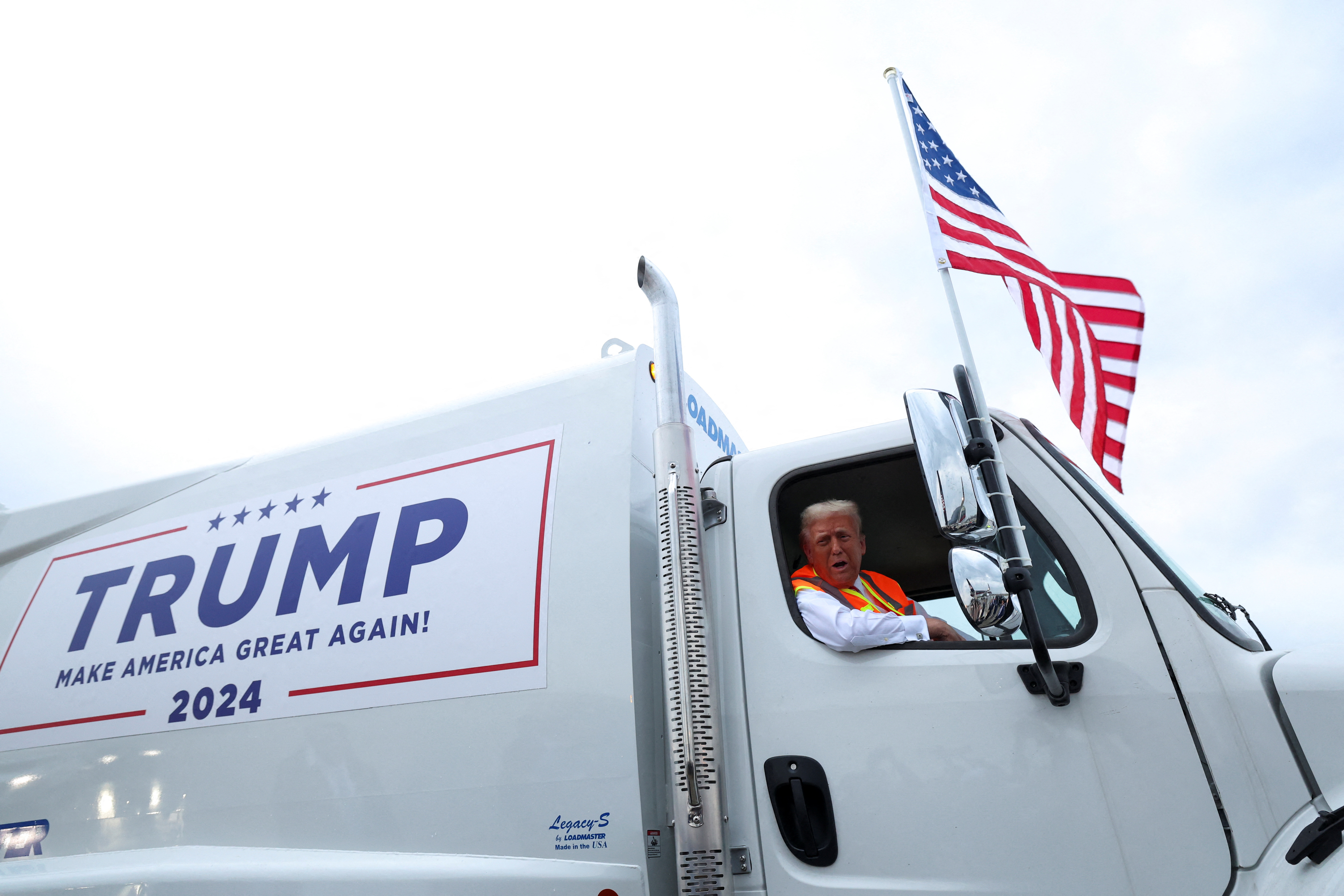 Republican presidential nominee and former U.S. President Donald Trump sits inside garbage truck, in Green Bay, Wisconsin, U.S., October 30, 2024. REUTERS/Brendan McDermid     TPX IMAGES OF THE DAY