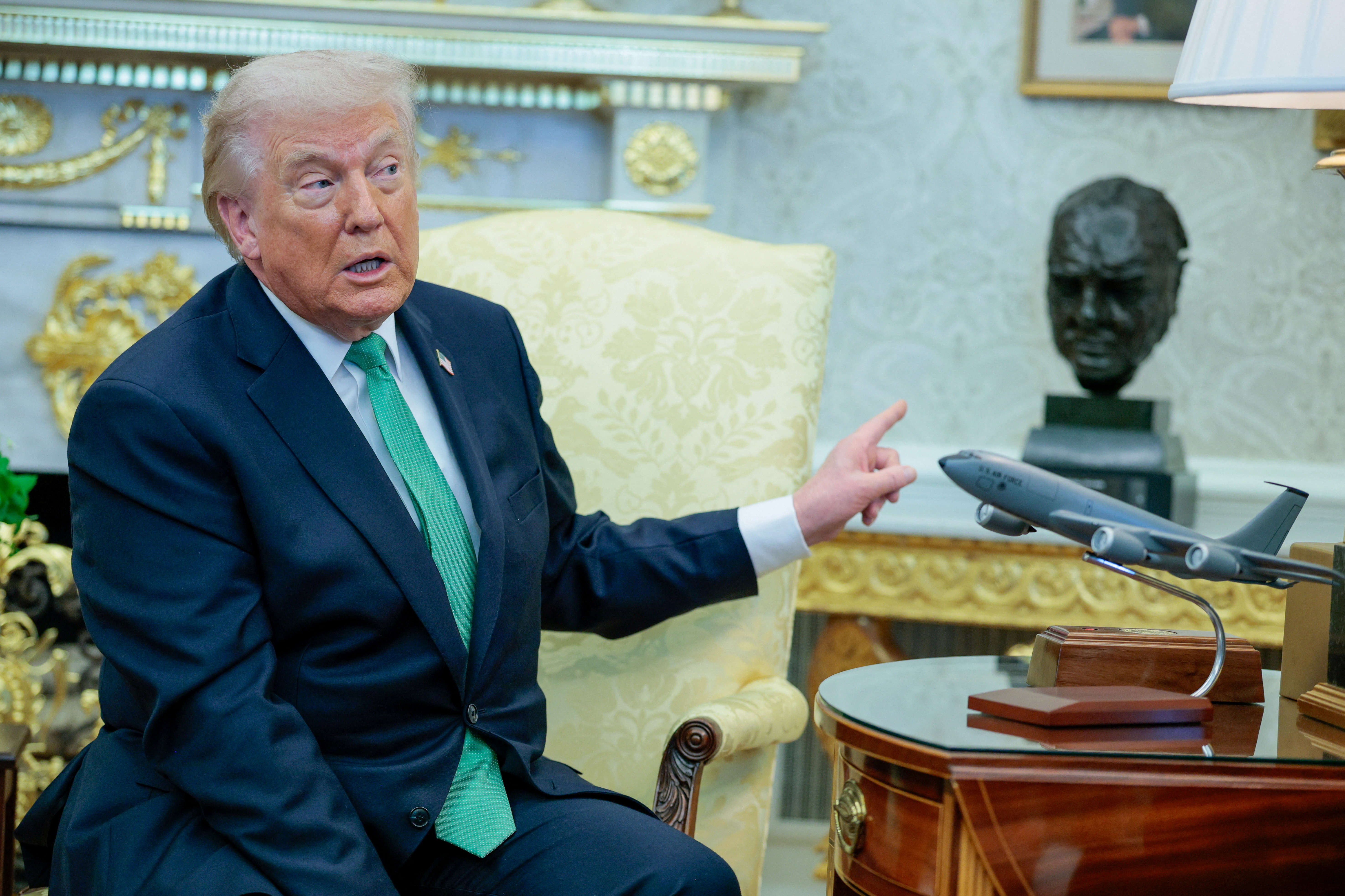 U.S. President Donald Trump gestures during a meeting with Irish Taoiseach (Prime Minister) Micheal Martin at the White House in Washington, D.C., U.S., March 17, 2026. REUTERS/Evan Vucci