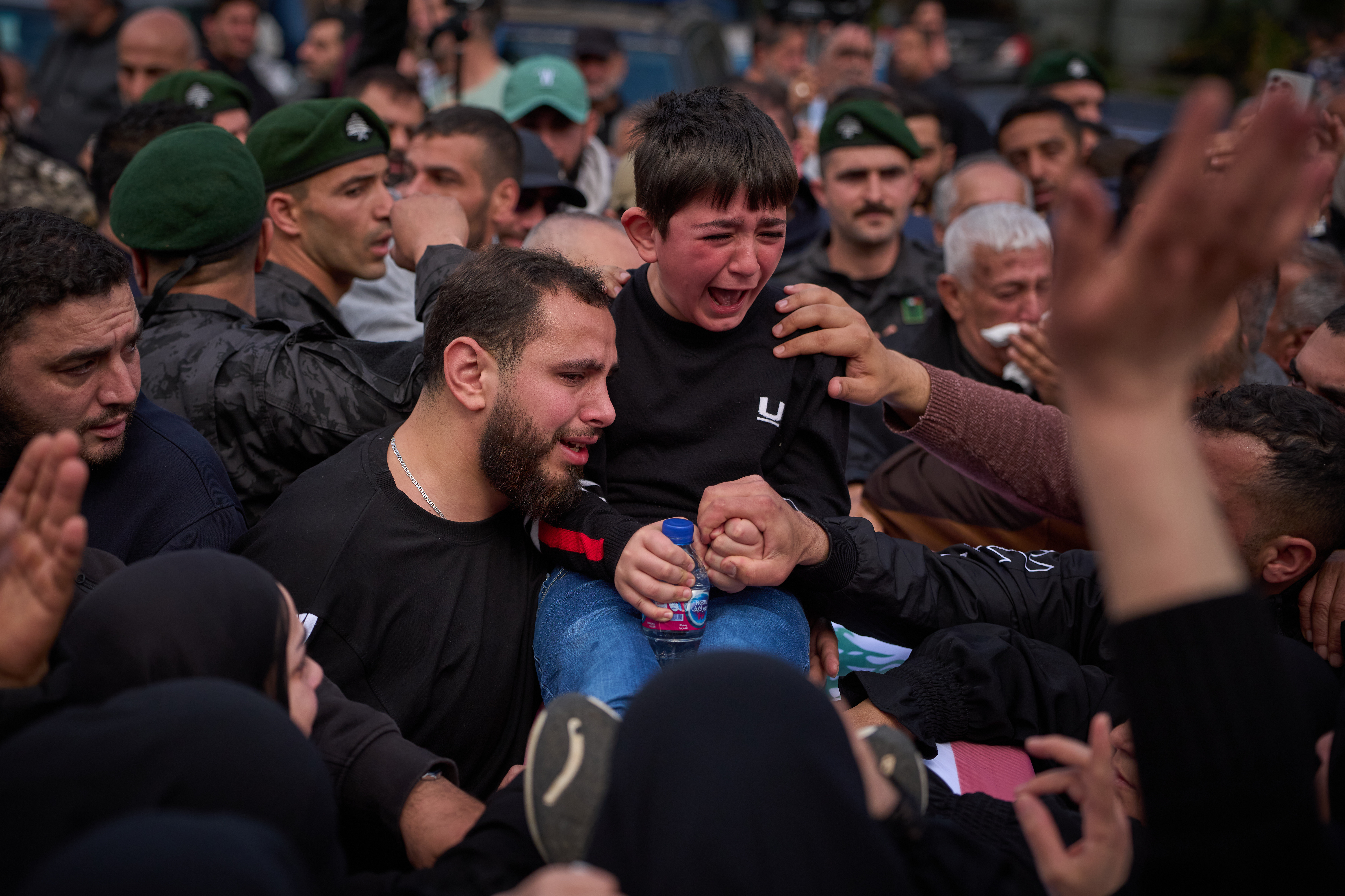 Mohammed, 8,  weeps next to the coffin of his father, Hussein Makkah, during the funeral of 13 state security officers killed the previous day in an Israeli strike in Lebanons coastal city of Sidon, Lebanon, Saturday, April 11, 2026. (AP Photo/Emilio Morenatti)