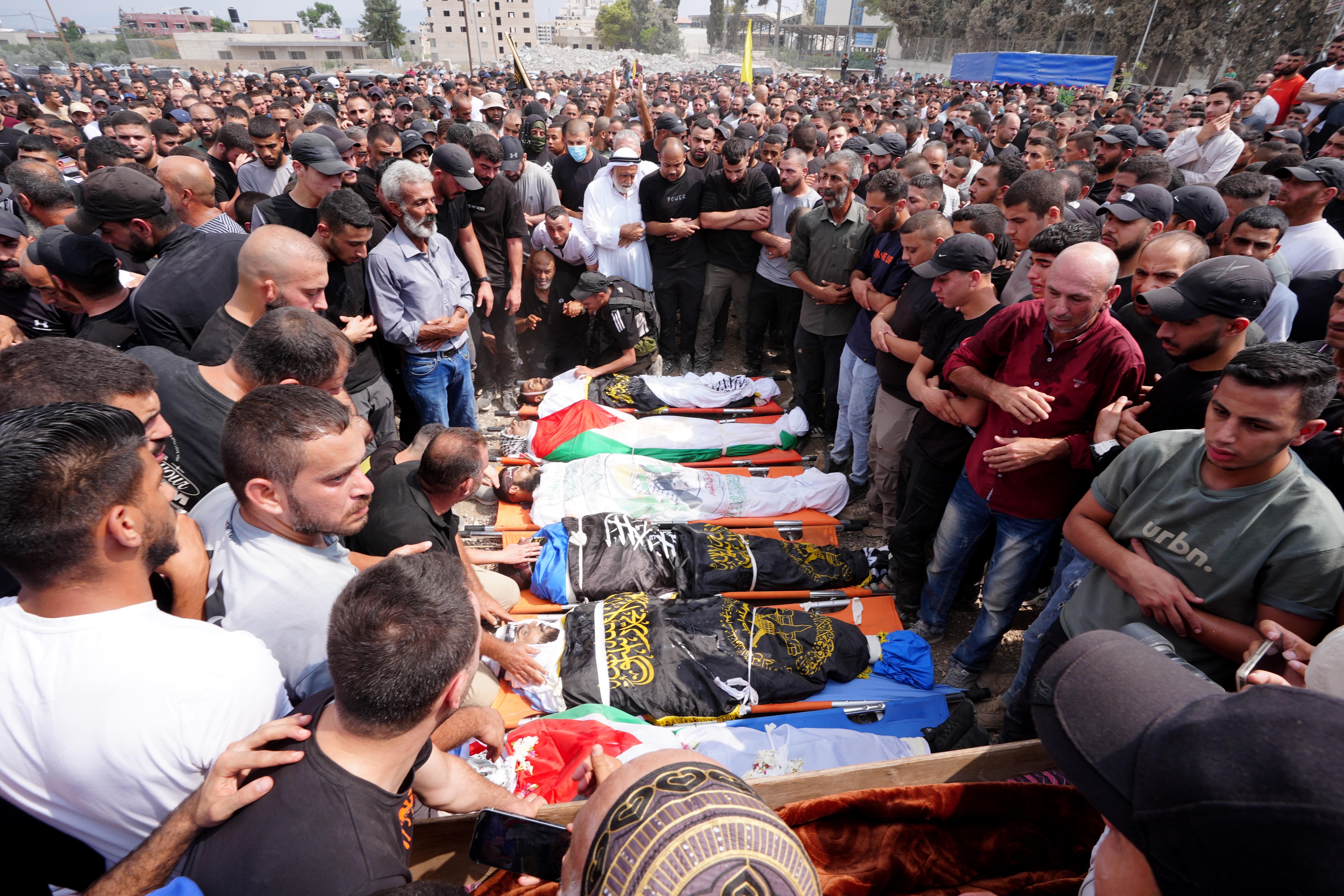 JENIN, WEST BANK - SEPTEMBER 06: (EDITORS NOTE: Image depicts death) Thousands of people attend the funeral ceremony of eight Palestinians, who died as a result of the Israeli army's 10-day-long attacks and raids on Jenin, West Bank on September 06, 2024. (Photo by Issam Rimawi/Anadolu via Getty Images)