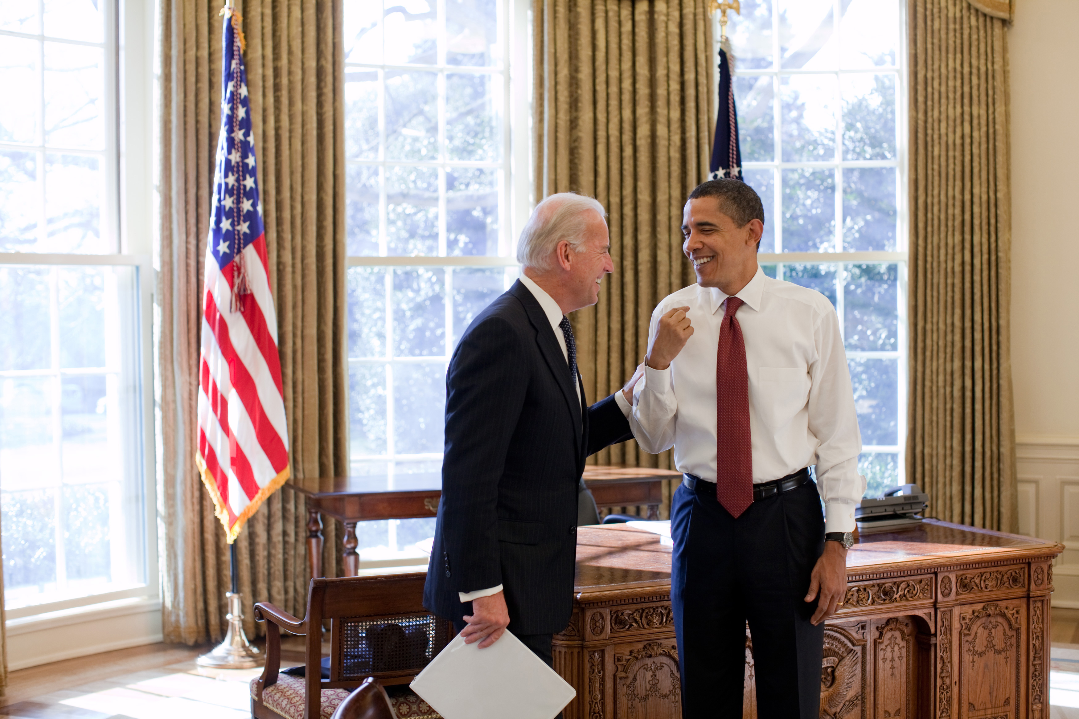 President Barack Obama and Vice President Joe Biden laugh together in the Oval Office, 1/22/09. . (Photo by: HUM Images/Universal Images Group via Getty Images)