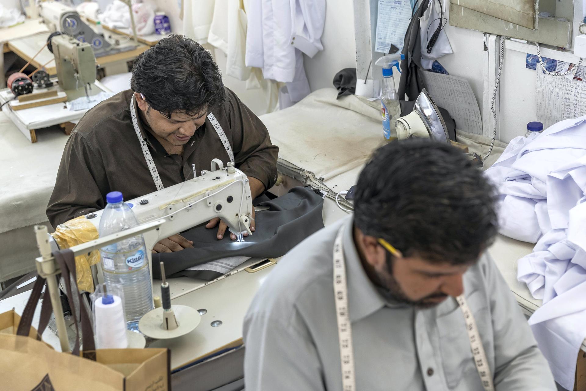 Tailors at a garment shop in Satwa prepare and finish sowing Eid clothes for the upcoming end of the Holy Month of Ramadan. Antonie Robertson / The National