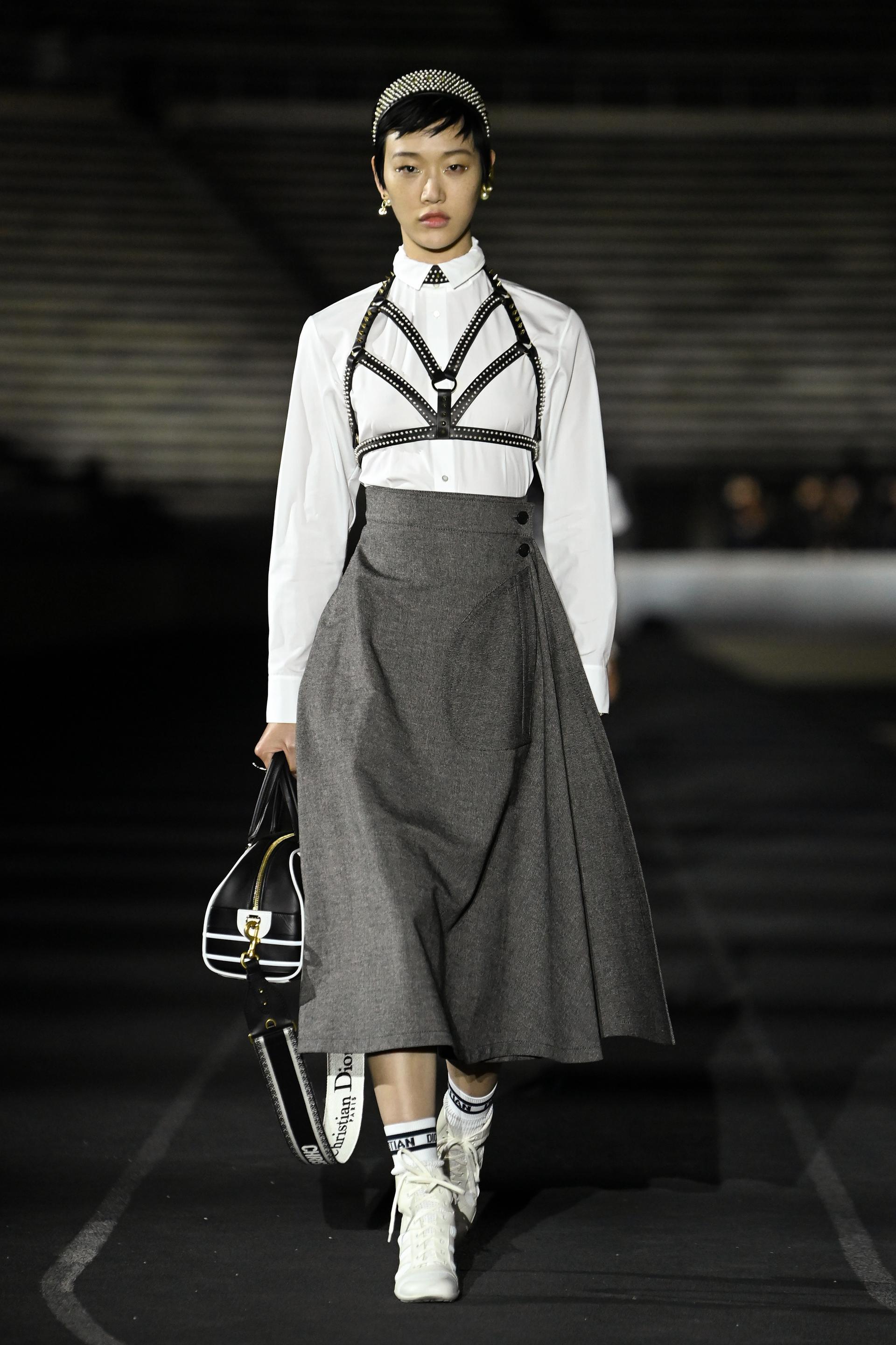 Christian Dior's staff pose on the runway during the Christian Dior News  Photo - Getty Images