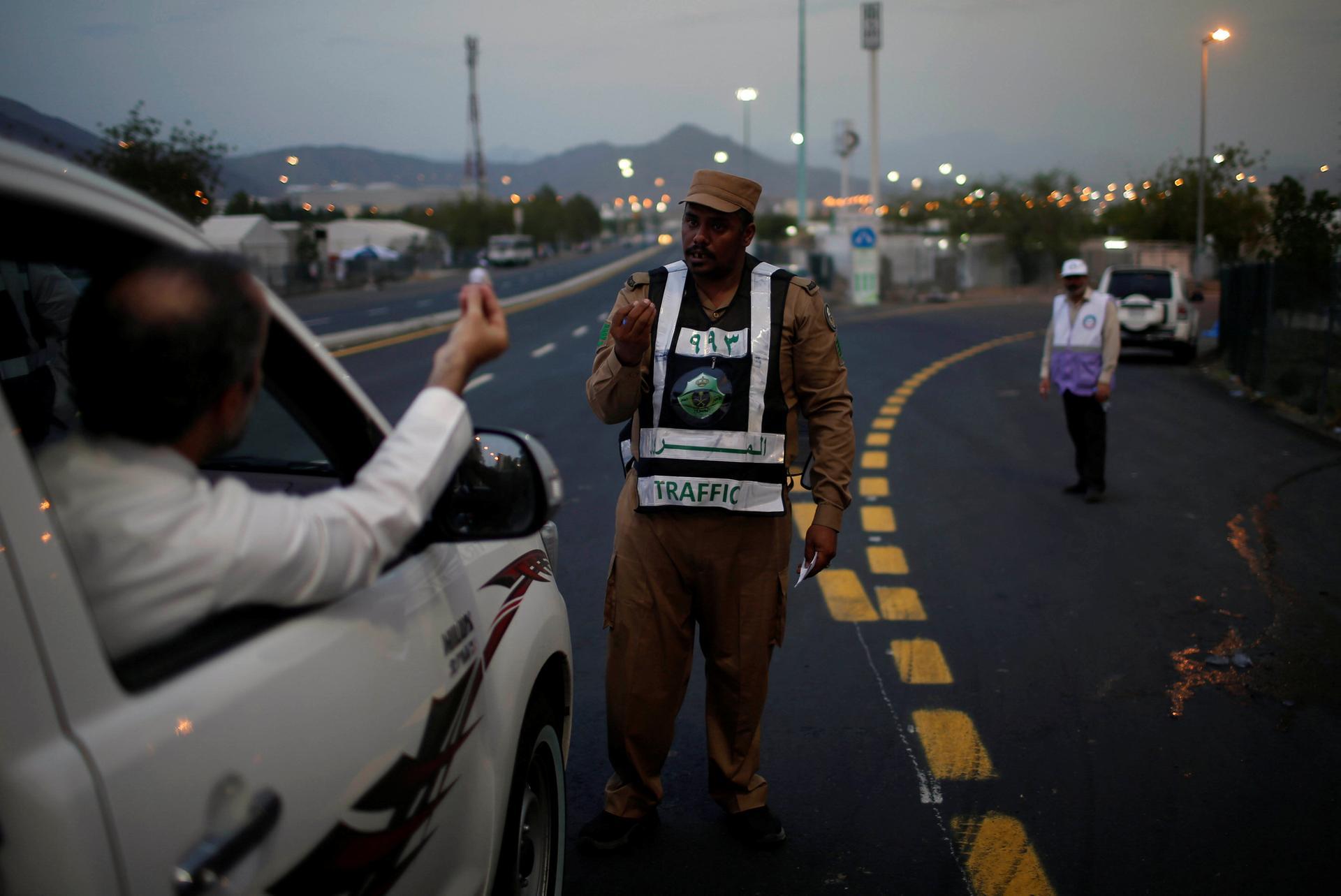 A Saudi police officer controls traffic in Arafat, Saudi Arabia. Reuters