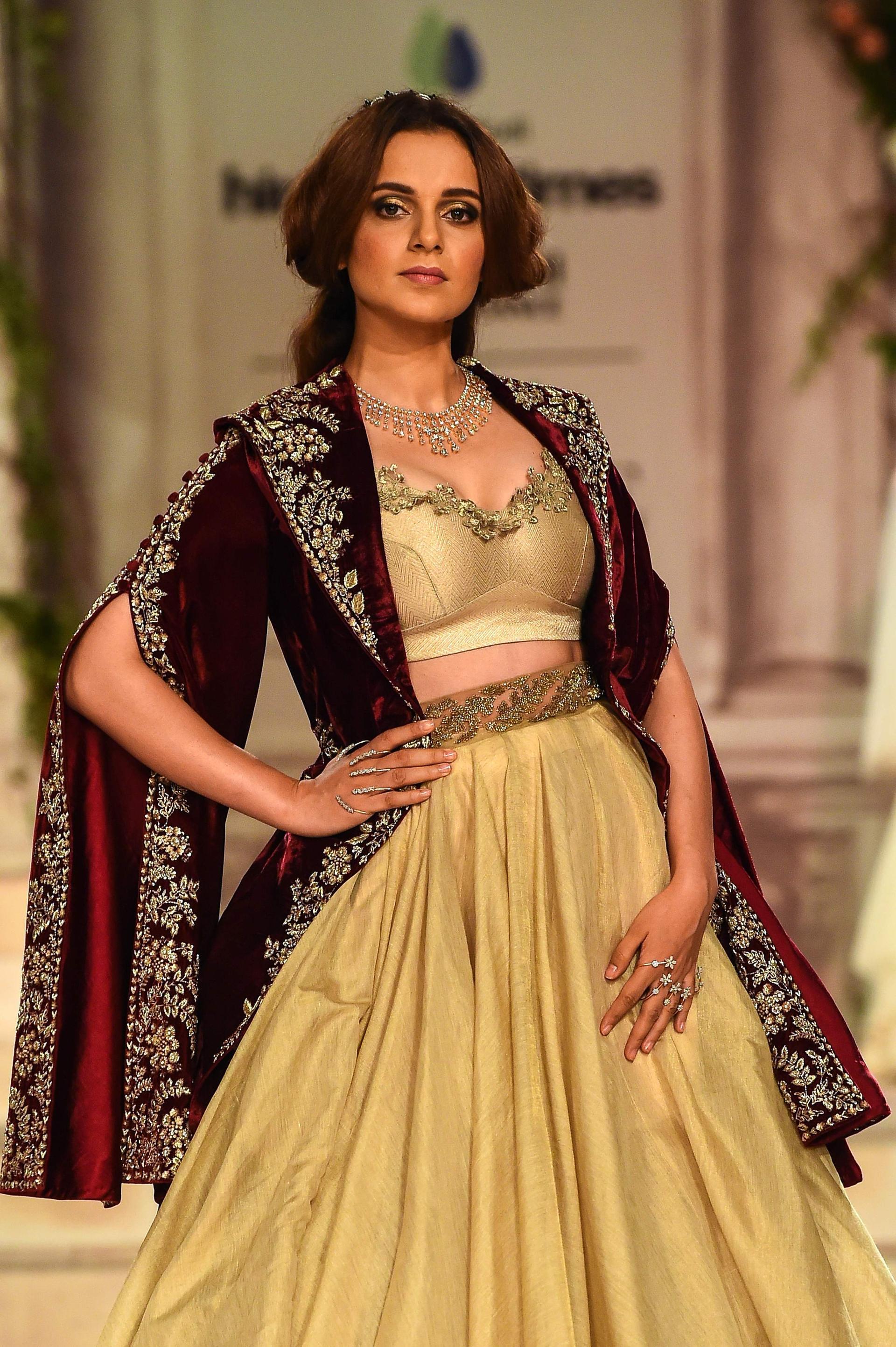 Here's a better look at that jacket. And those jewels. AFP