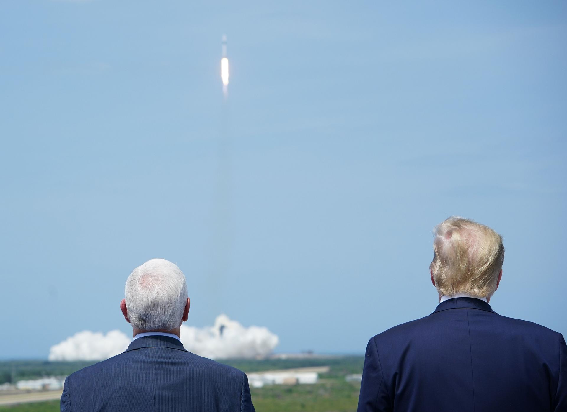 US Vice President Mike Pence and US President Donald Trump watch the SpaceX Falcon 9 rocket carrying the SpaceX Crew Dragon capsule, with astronauts Bob Behnken and Doug Hurley, lift off from Kennedy Space Centre in Florida. AFP