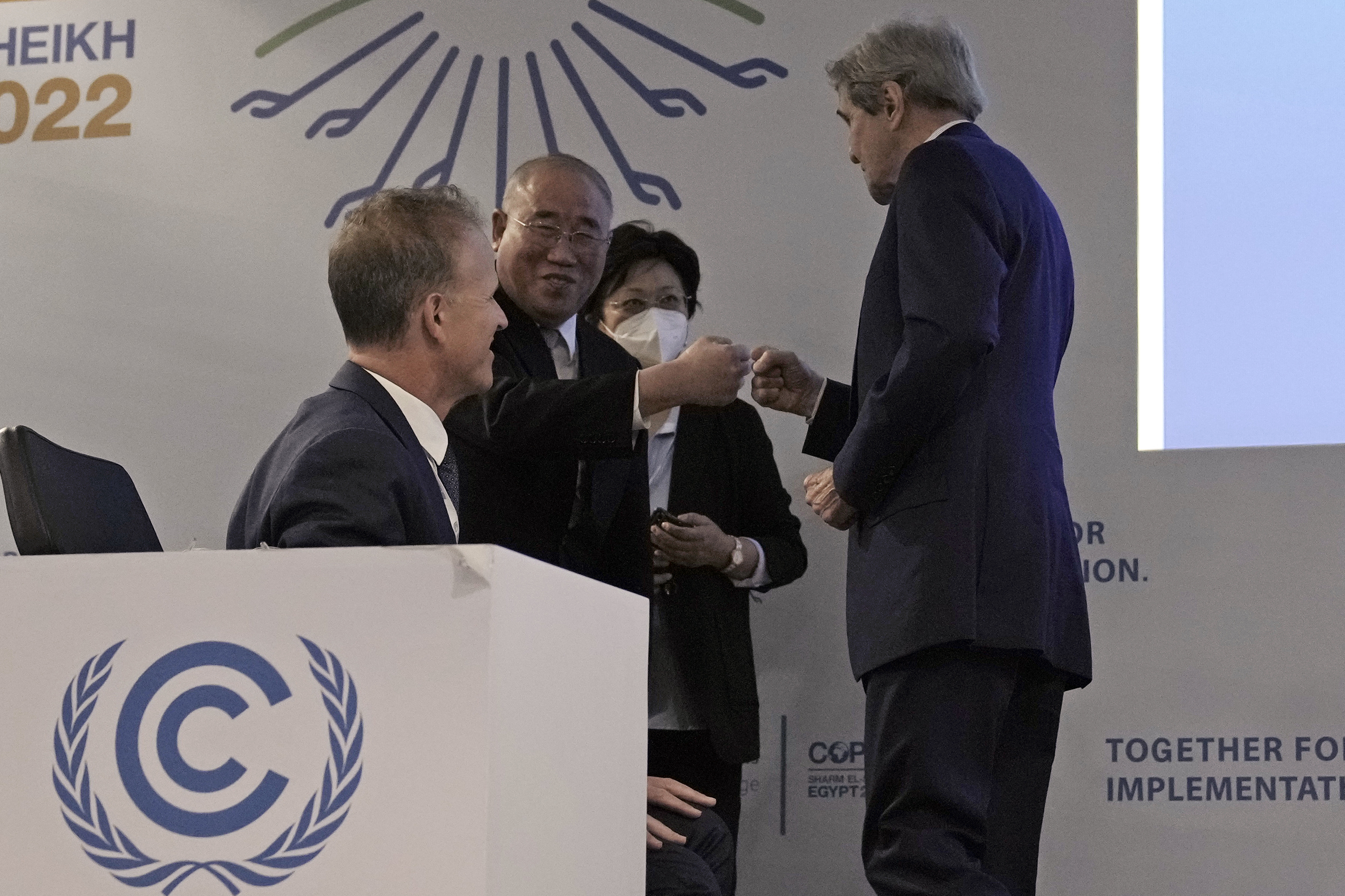US Special Presidential Envoy for Climate John Kerry, right, and Xie Zhenhua, China's special envoy for climate greet each other at the COP27 UN Climate Summit in Sharm el-Sheikh, Egypt. AP