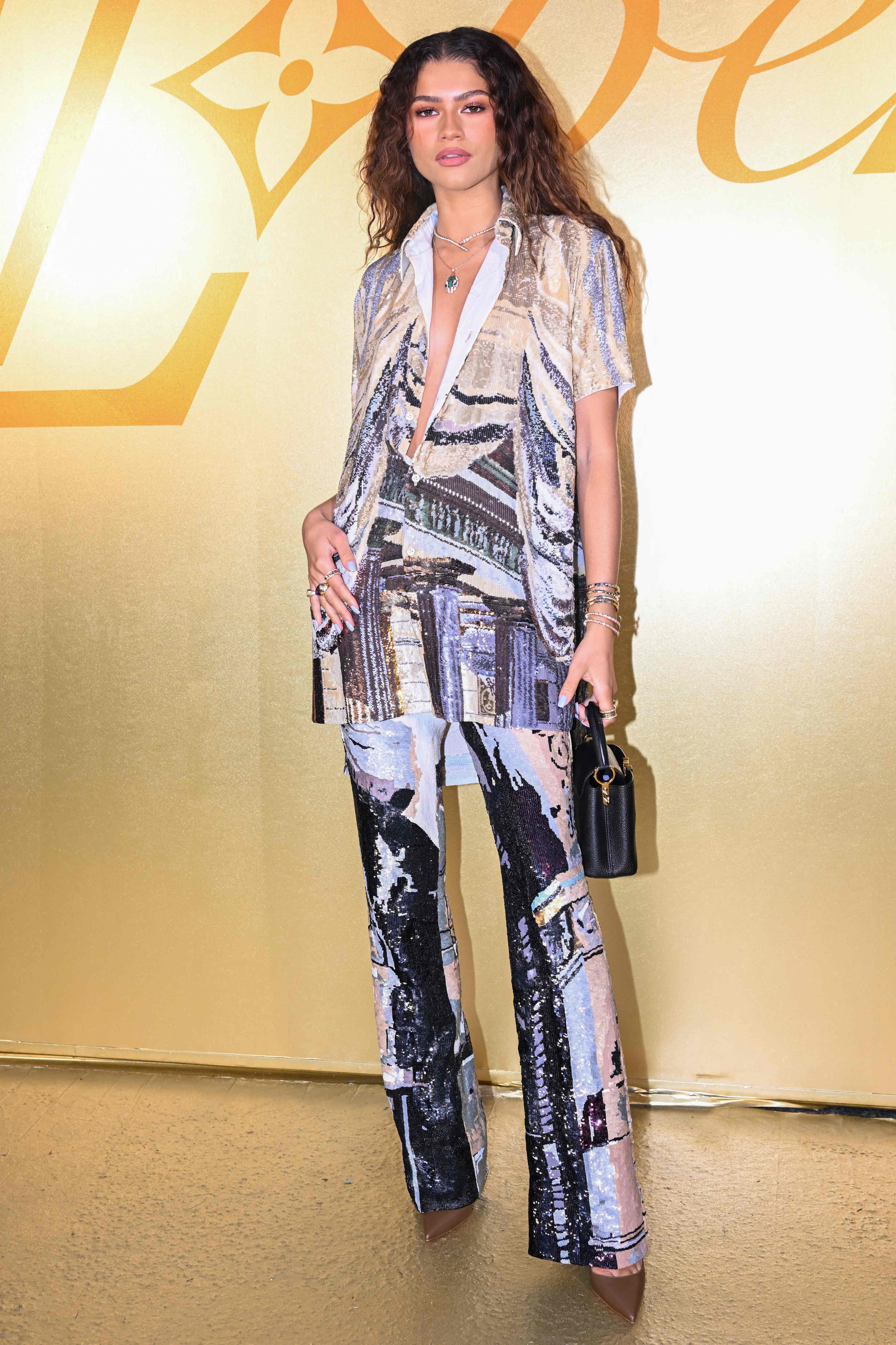 Celebrities in Louis Vuitton Archlight Sneakers: Bella Hadid & More –  Footwear News