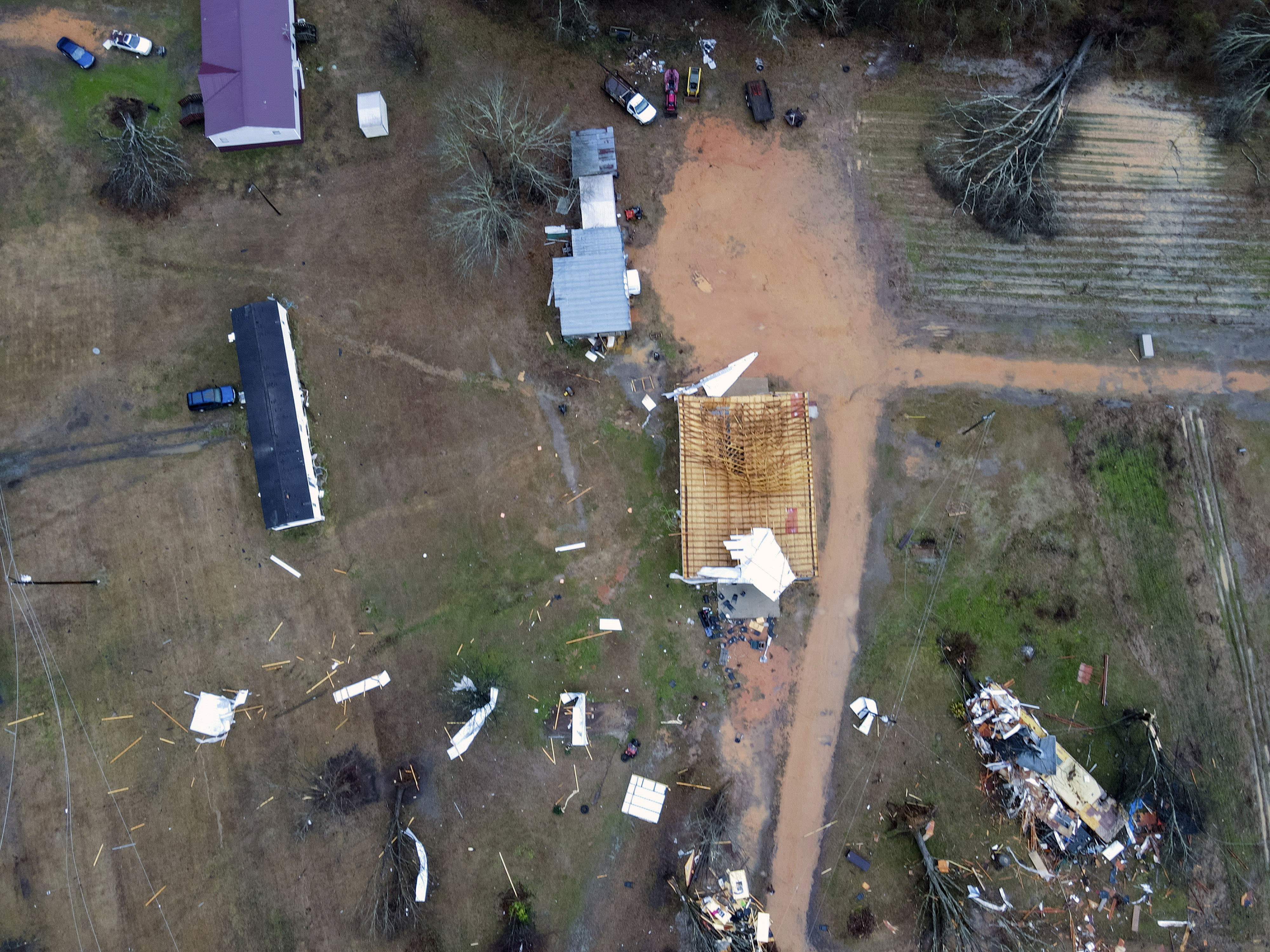 A giant storm system across the South spurred a tornado that shredded the walls of homes and toppled roofs in many towns in Alabama. AP