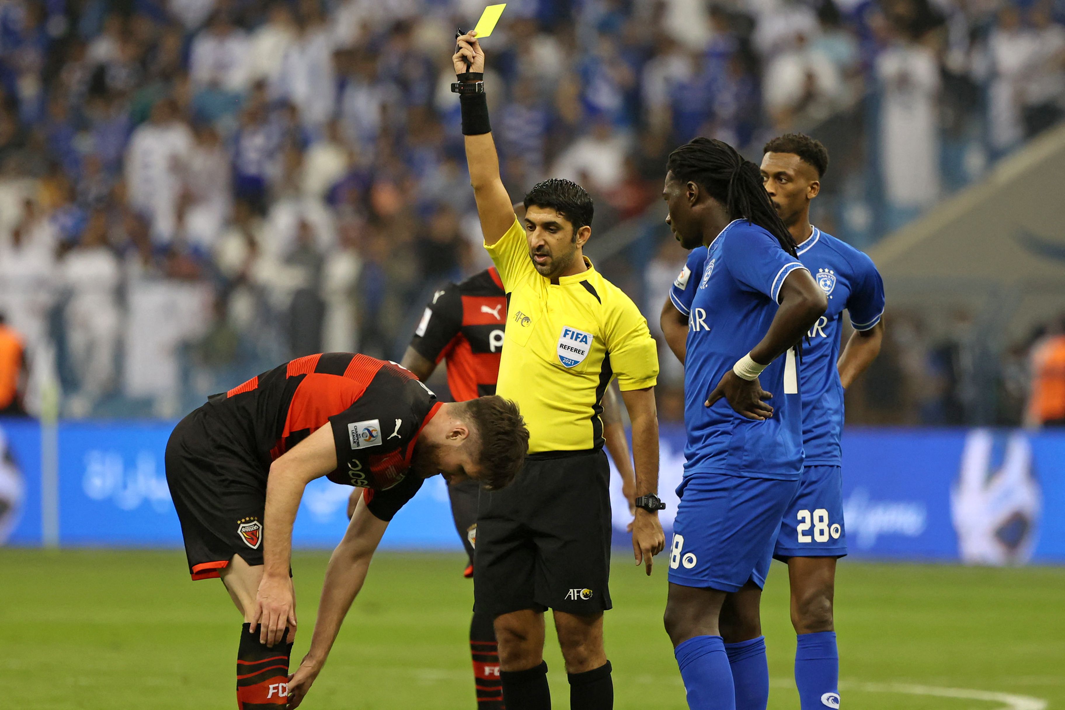 Saudi Arabia's Al Hilal soccer team players celebrate their trophy of the  AFC Champions League 2021 after the team beats South Korea's Pohang  Steelers 2-0 during their final soccermatch at the King