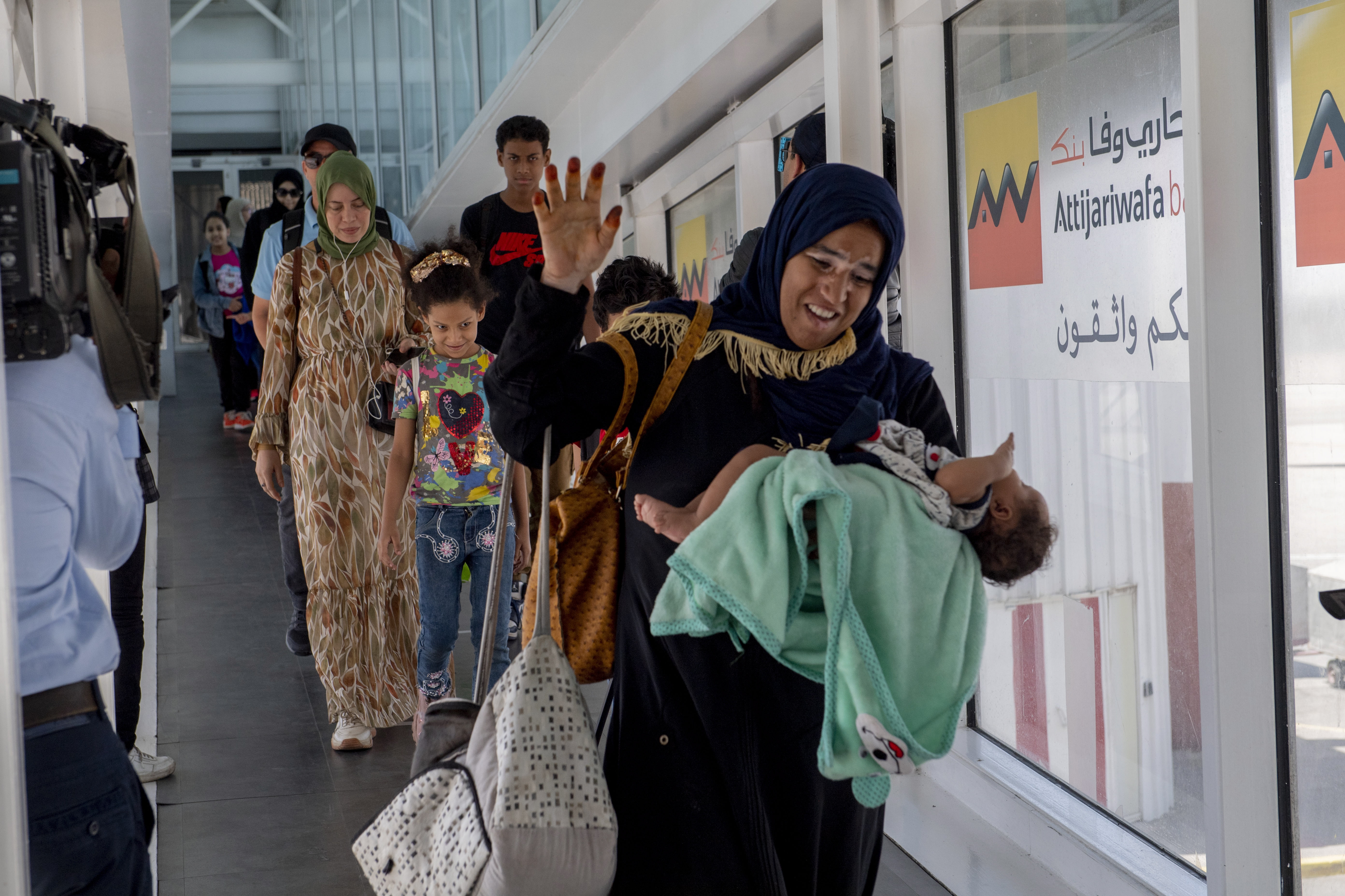 Moroccan nationals, who have been evacuated from Sudan, arrive at Mohammed V airport in Casablanca, Morocco. EPA