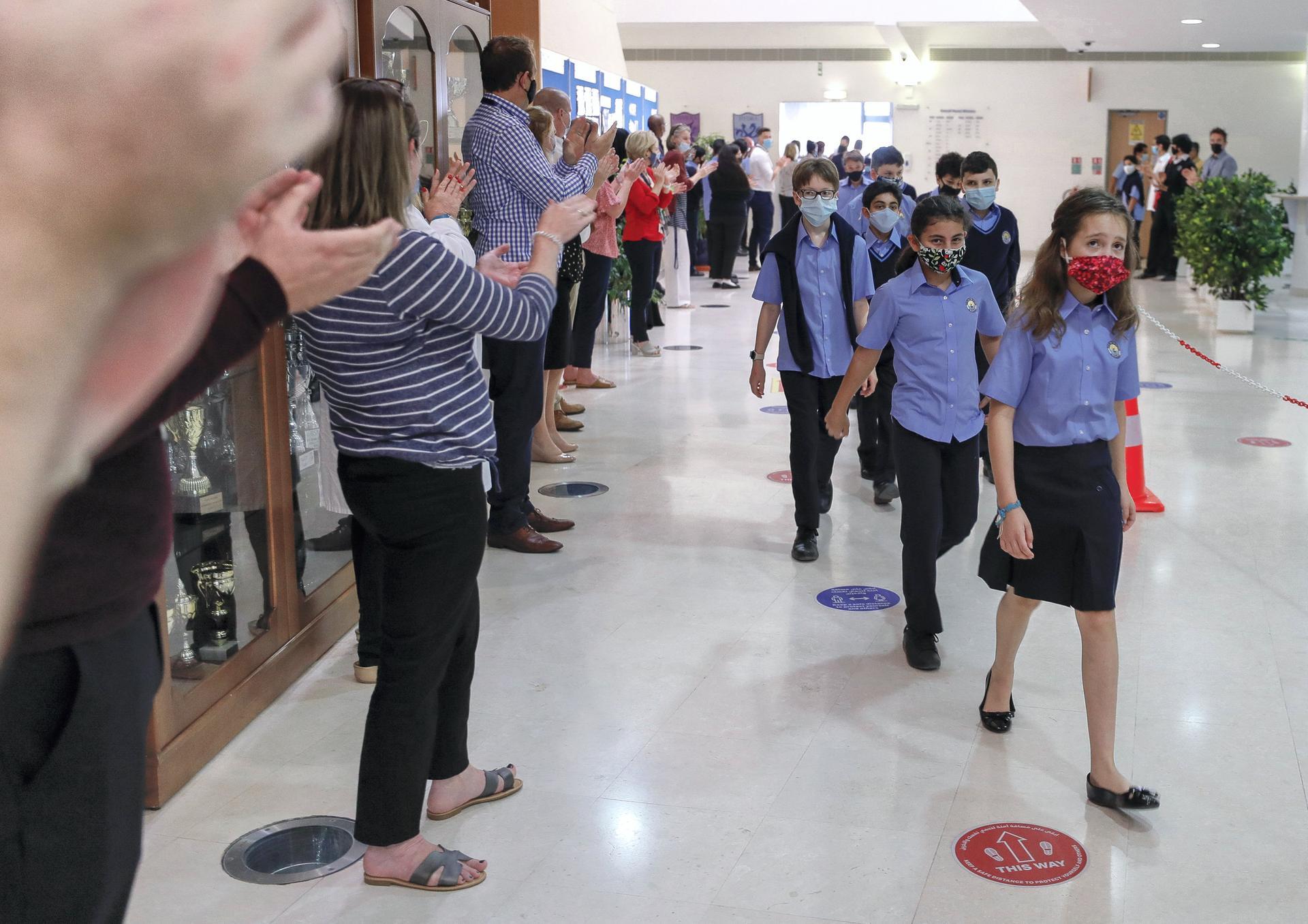 Pupils were cheered all the way to class at British School Al Khubairat after the returning to school. Victor Besa / The National