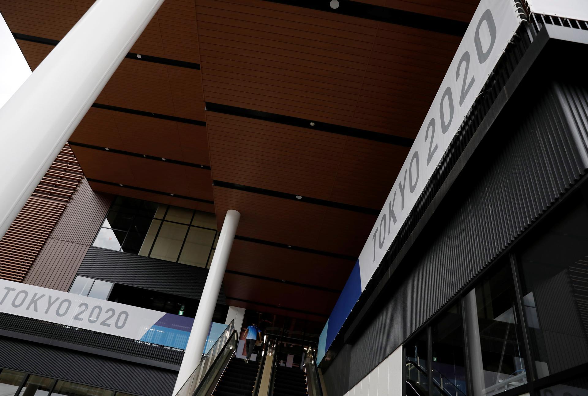 A man enters the multi-function complex of the Tokyo 2020 Olympic and Paralympic Village.