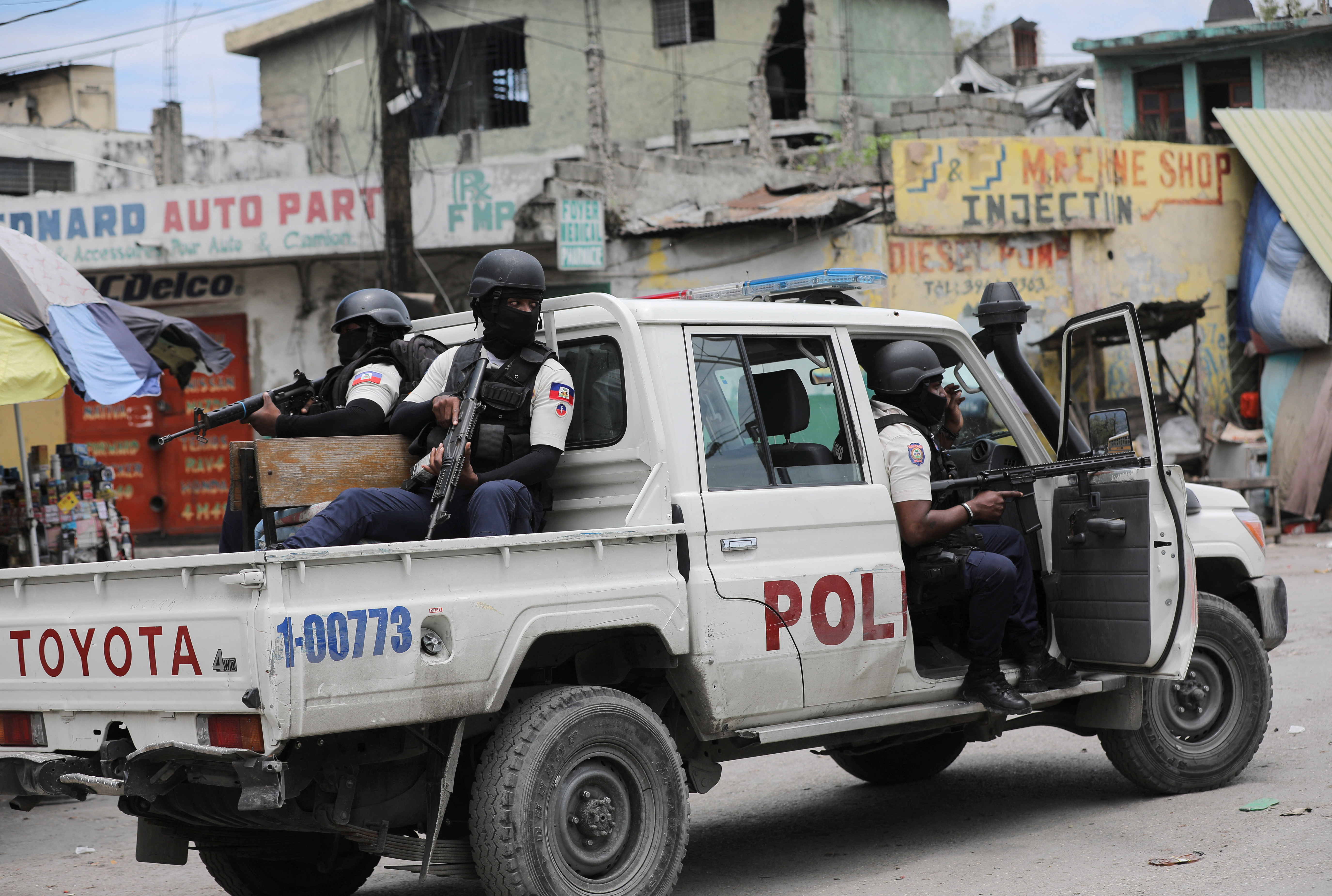 Police patrol the streets after gang members tried to attack a police station in Port-au-Prince, Haiti's capital. Reuters