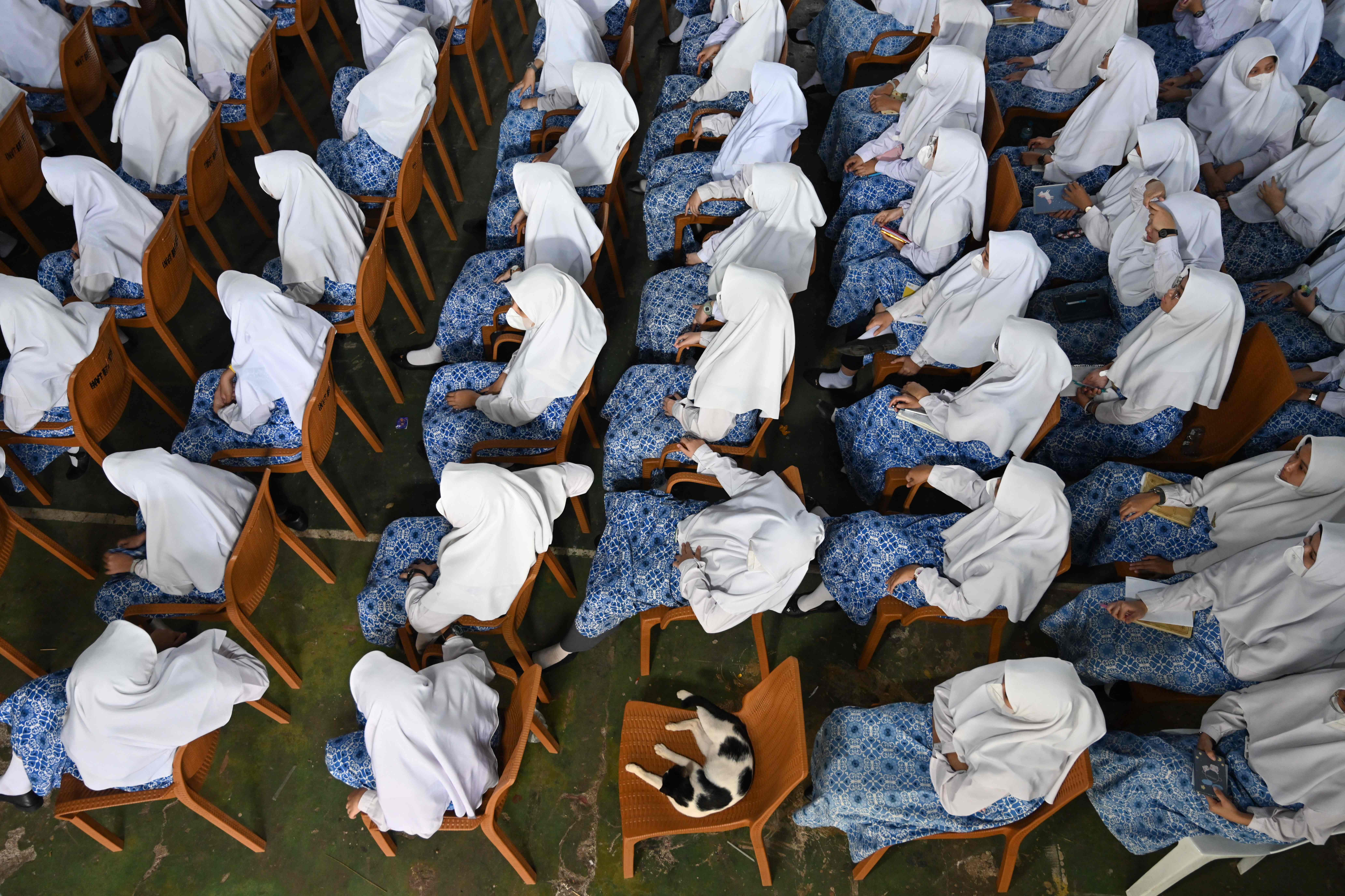 Indonesian students in Jakarta attend a ceremony during a visit by the Nottinghamshire Band of the Royal Engineers to celebrate British Queen Elizabeth II's platinum jubilee. AFP
