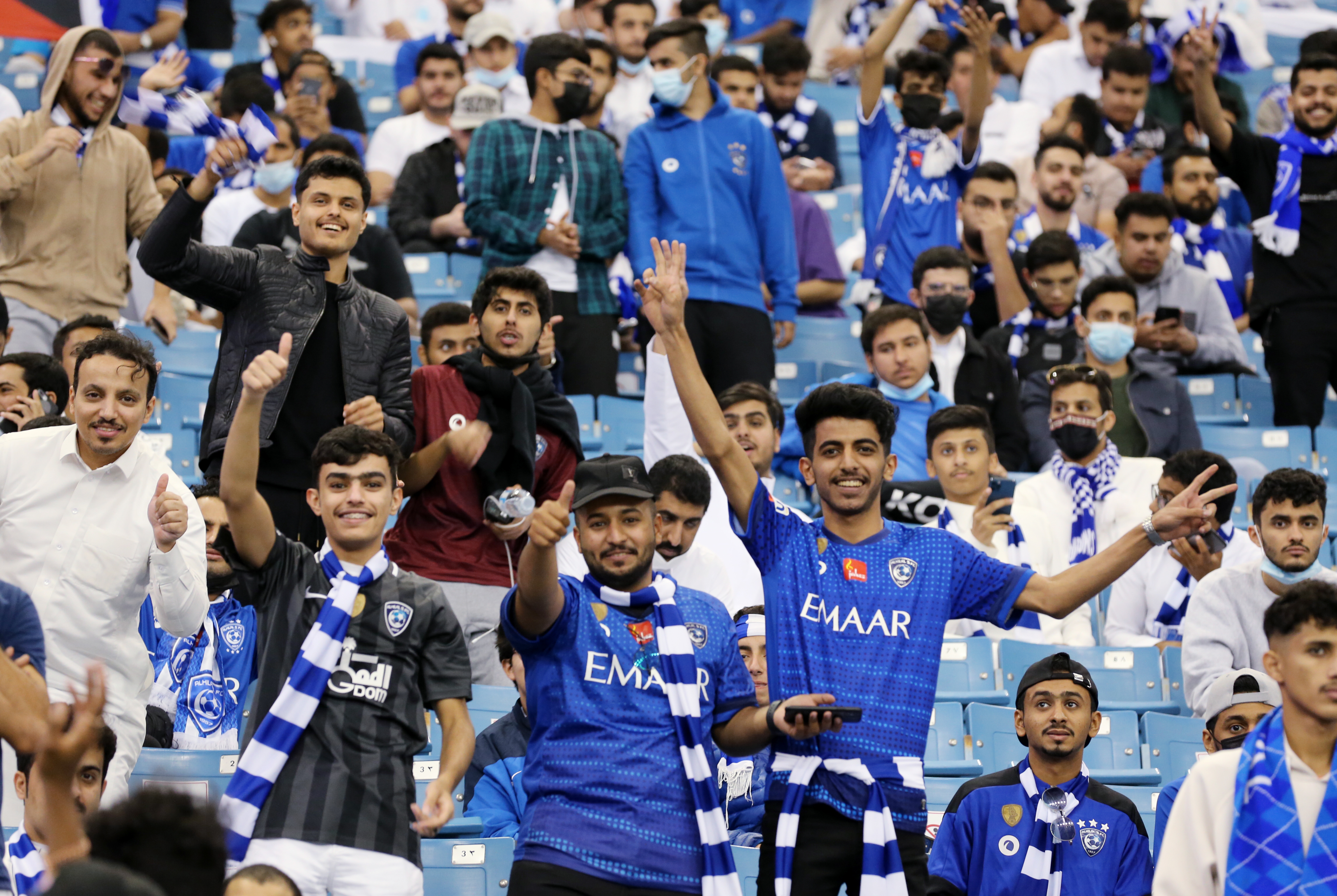 Saudi Arabia's Al Hilal soccer team players celebrate their trophy of the  AFC Champions League 2021 after the team beats South Korea's Pohang  Steelers 2-0 during their final soccermatch at the King