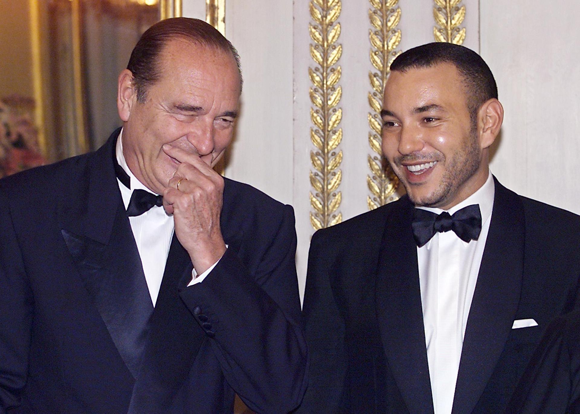 French President Jacques Chirac laughs with King Mohammed VI prior a state dinner at the Elysee Palace in March, 2000. AFP