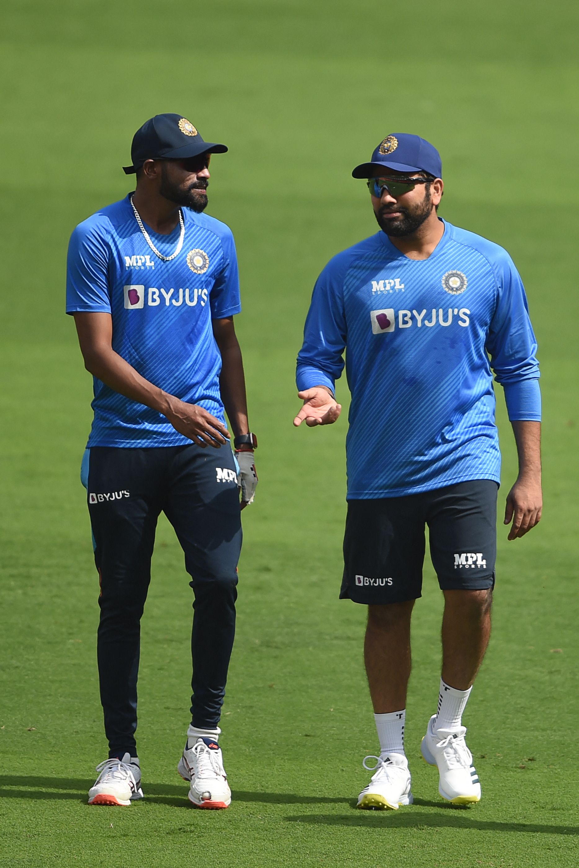 Captain Rohit Sharma, right, with teammate Mohammed Siraj during a practice session at the Narendra Modi Stadium in Ahmedabad. AFP