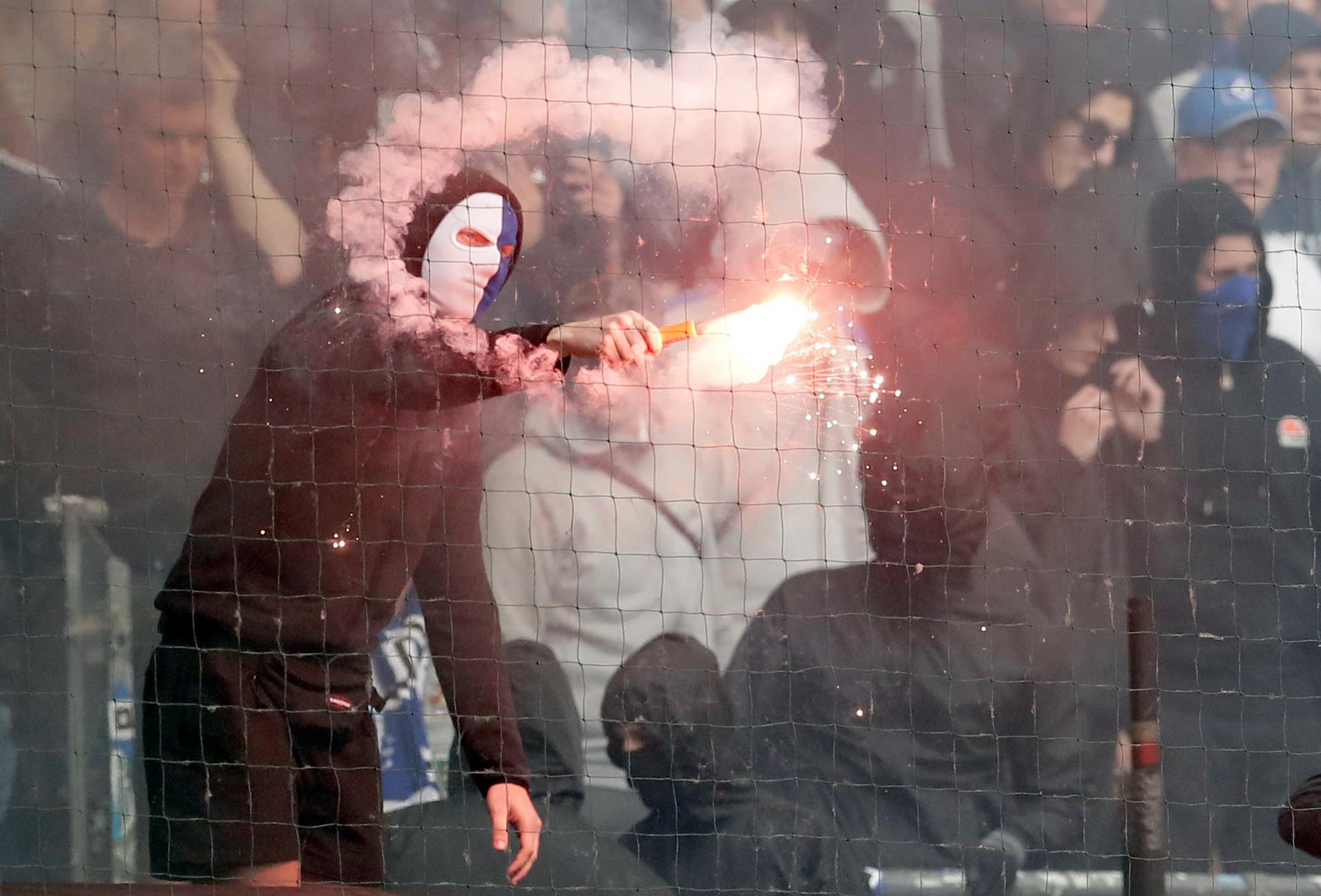 Supporters throw flares as Hamburg relegated from Bundesliga for