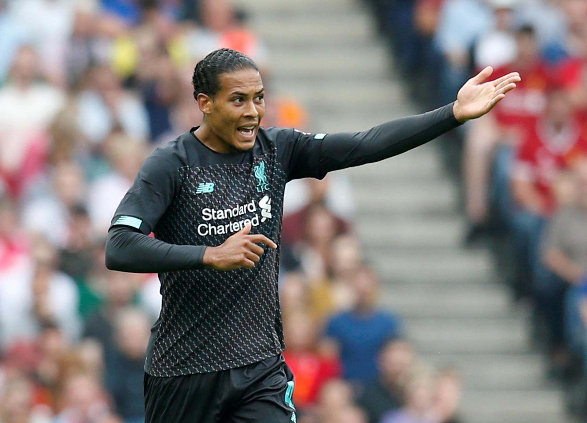 Liverpool's Virgil van Dijk shouts instructions during the game. Reuters