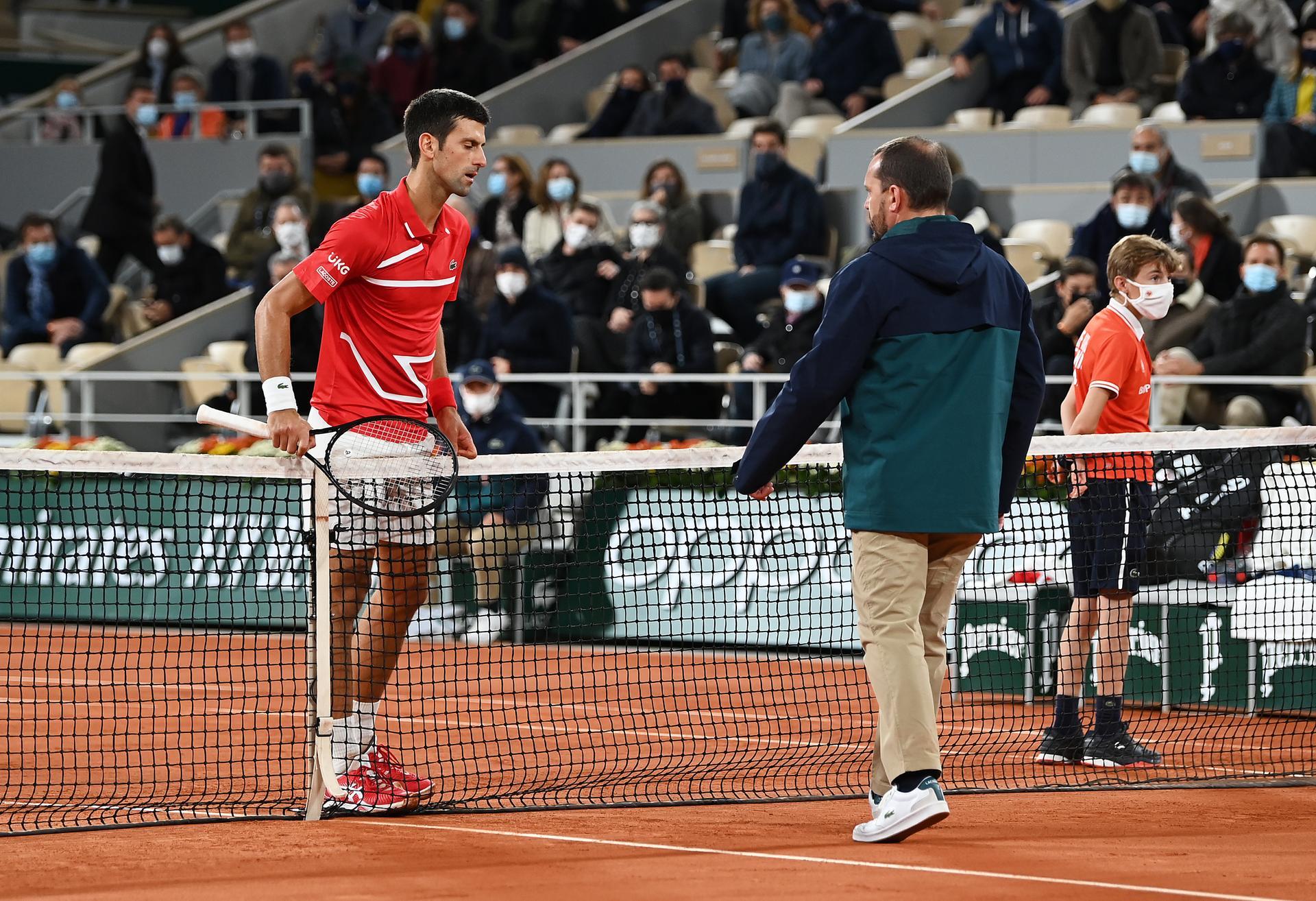 Djokovic fights virus to win in Paris; exhausted Sinner slams