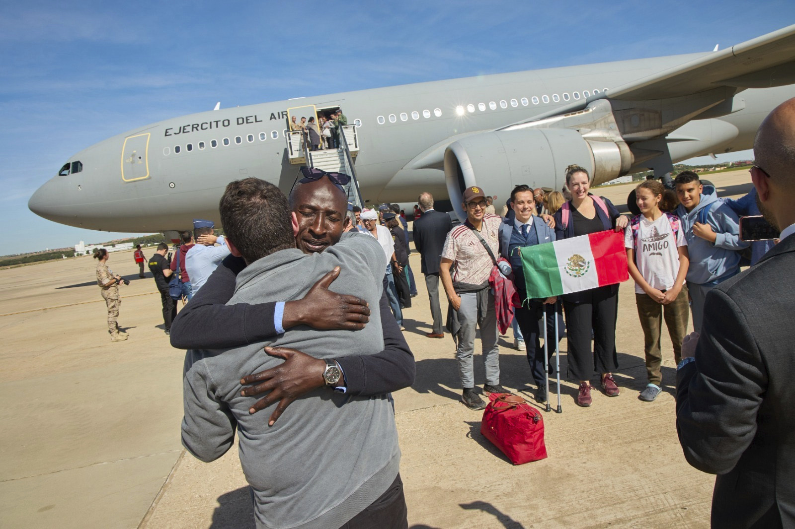 Passengers from Sudan disembark from a Spanish Air Force plane at Torrejon Airbase in Madrid. AP