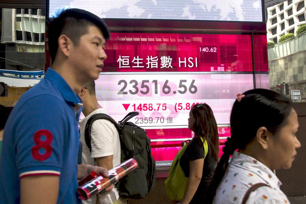 Hong Kong’s benchmark index plunged the most since the global financial crisis as an equity rout in mainland China rippled across Asia. The Hang Seng Index fell 5.8 per cent to 23,516.56 at the close on Wednesday. Tyrone Siu / Reuters