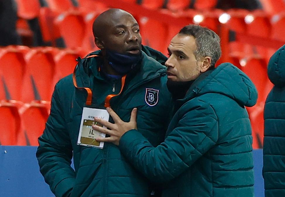 Basaksehir assistant coach Pierre Webo is led away during the Uefa Champions League match between Paris Saint-Germain and Istanbul Basaksehir after allegations of racism. EPA