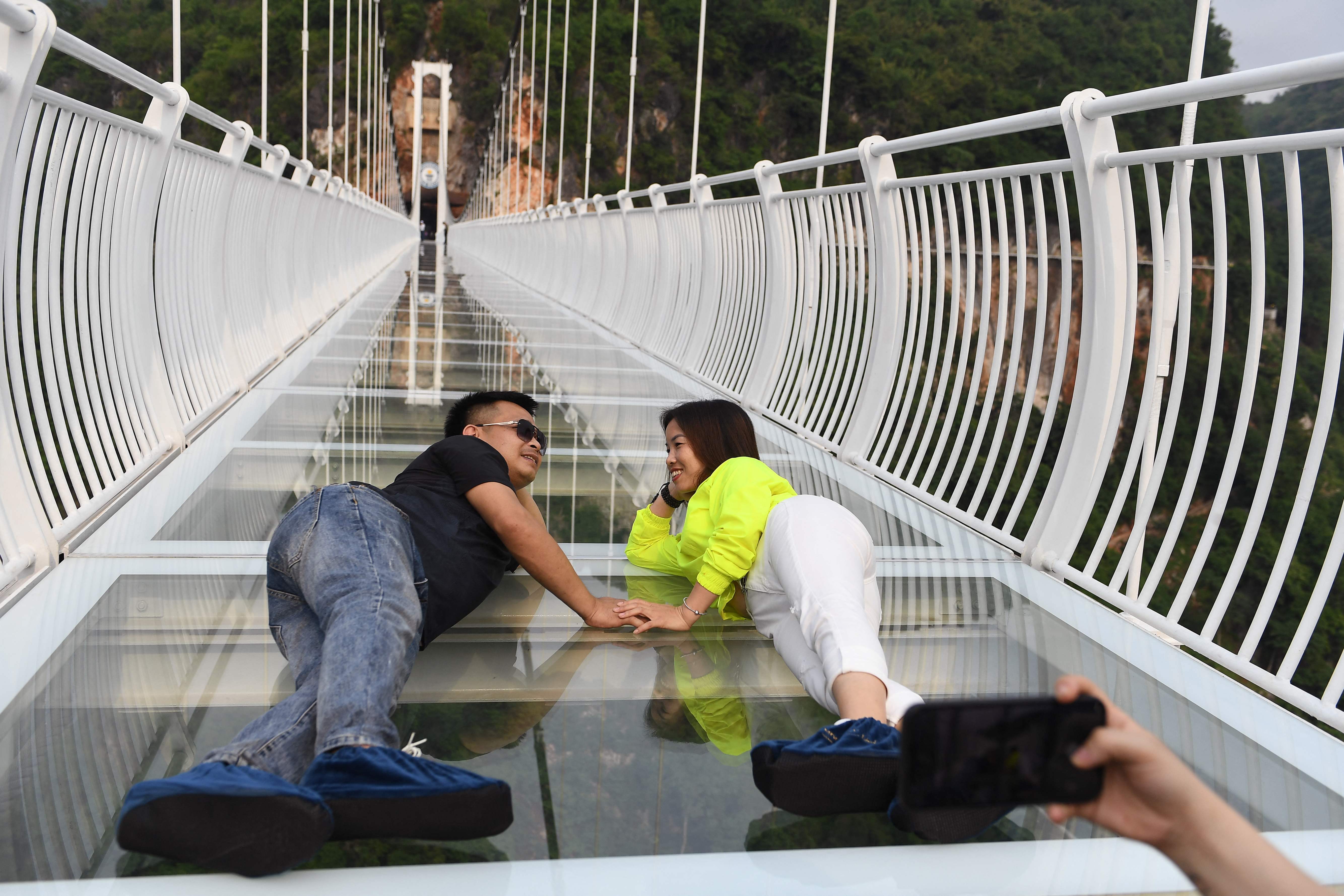 Don't look down: 'world's longest' glass-bottomed bridge opens in ...