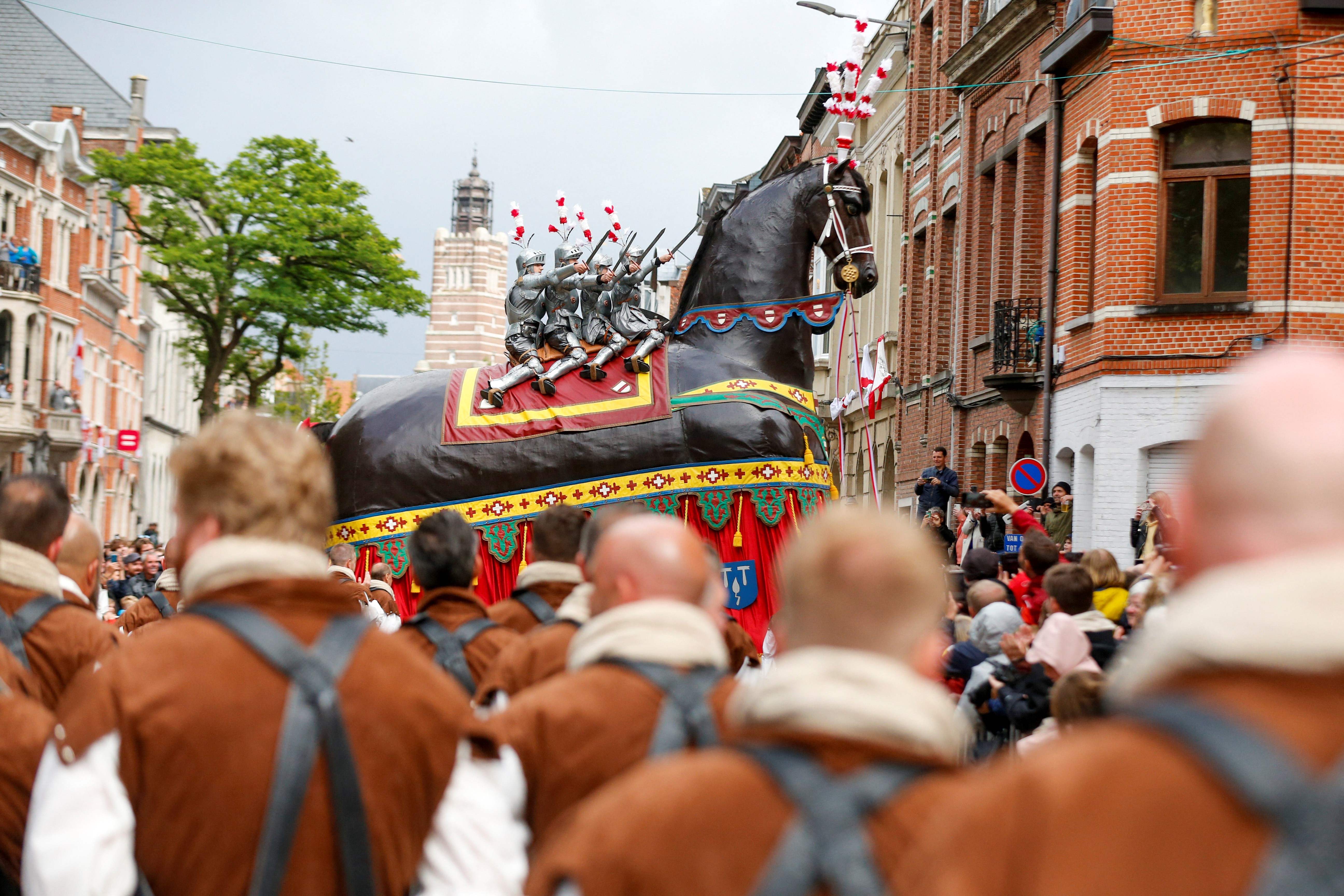 The "Ros Beiaardommegang" procession, featuring a heroic horse from folklore, in Dendermonde, Belgium. The parade should have taken place in 2020 but was postponed twice because of the Covid-19 pandemic. AFP