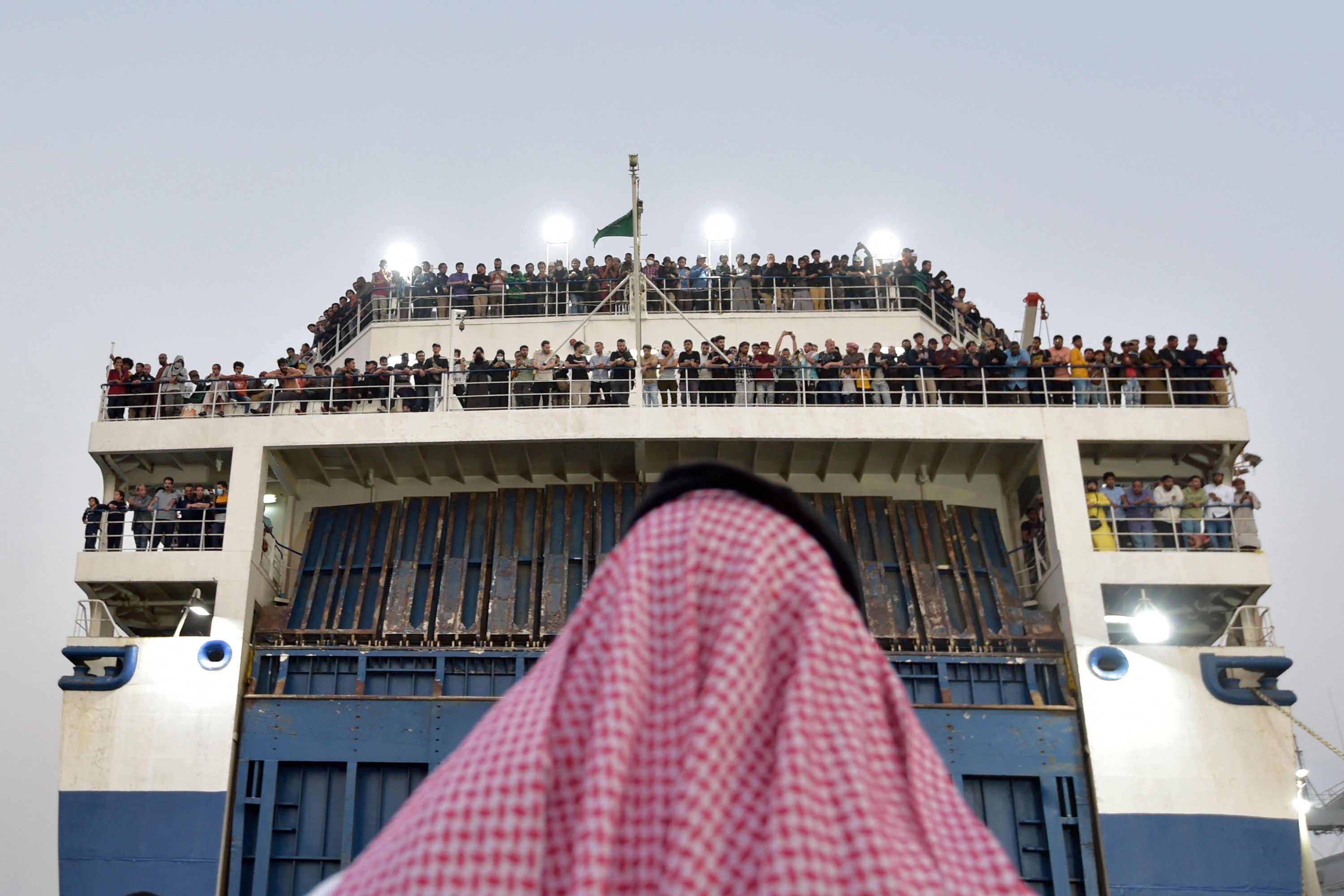 A boat with 1,687 civilians from more than 50 countries fleeing violence in Sudan, arrives at King Faisal naval base in Jeddah, Saudi Arabia. AFP