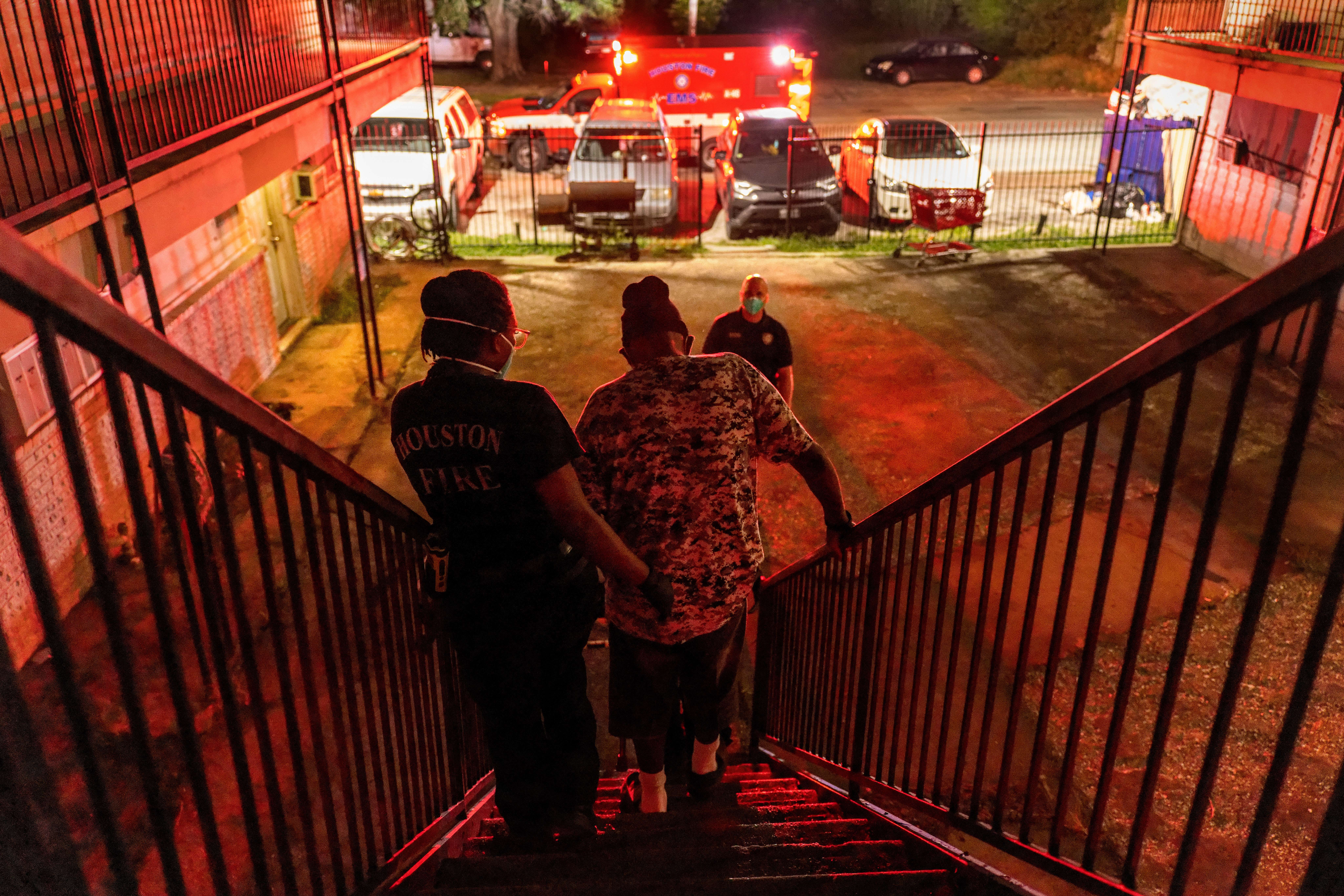 Medics transport a Covid-positive patient to a hospital in Houston, Texas. AFP