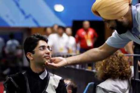 The gold medal won by Abhinav Bindra, left, comes at a critical time in Indian sport.