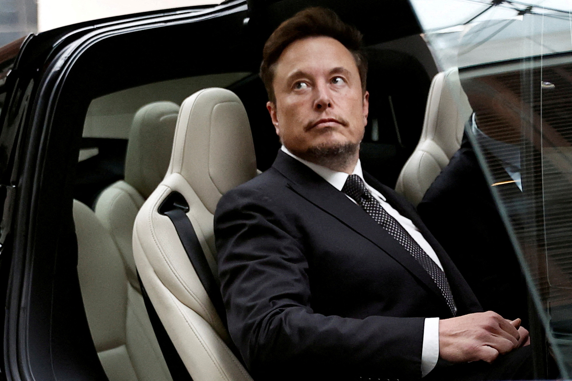 Elon Musk sheds $20bn after Tesla shares slide on lower margins and price  cuts
